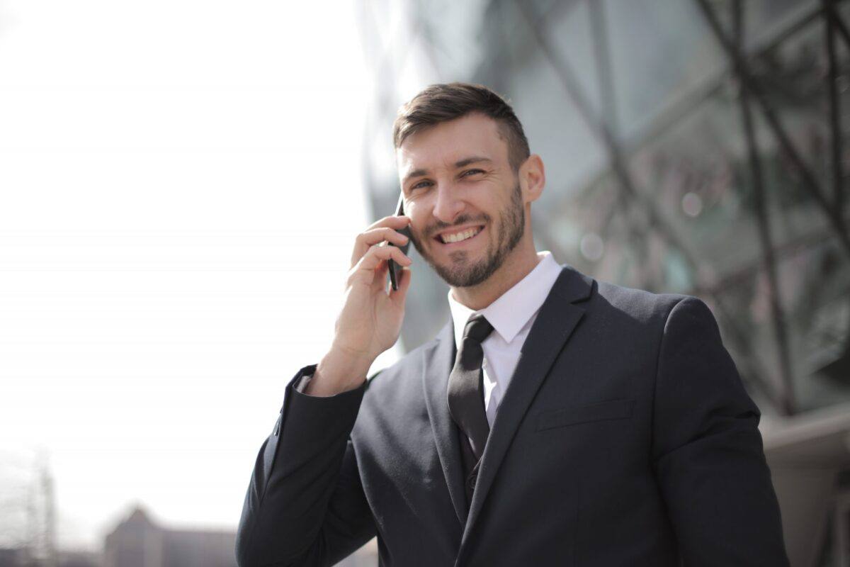 Canva - Man in Black Suit Jacket Holding Smartphone Canva - Man in Black Suit Jacket Holding Smartphone