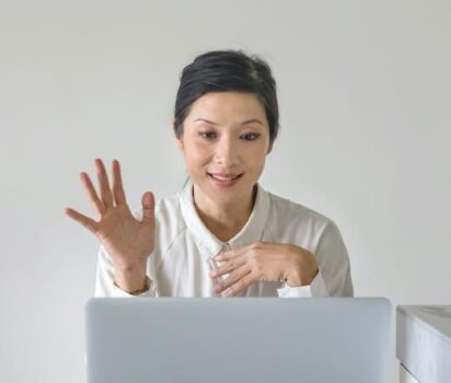 Woman Waving to Applicant Online