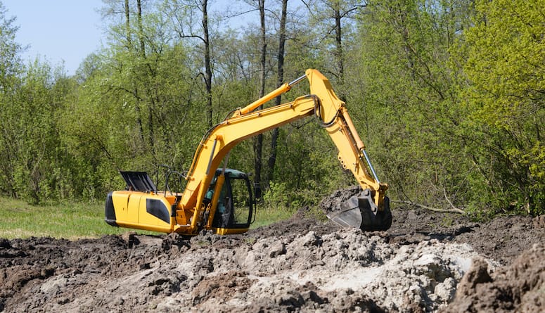 Excavator Working on Swamp Area